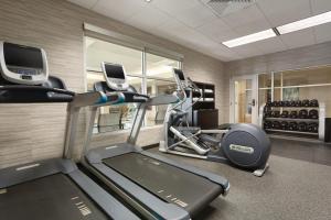 a gym with two tread machines and a treadmill at Courtyard by Marriott Fort Smith Downtown in Fort Smith