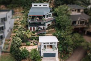 an aerial view of a large white house at Retro Retreat - by Coast Hosting in Terrigal