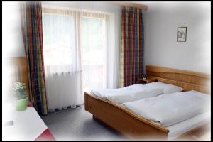 Postel nebo postele na pokoji v ubytování Haus Barbara