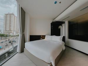 Postel nebo postele na pokoji v ubytování The Concept Hotel HCMC- District 1