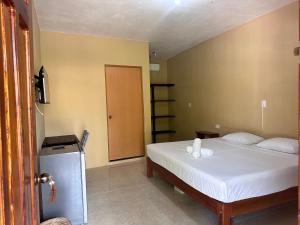 Postel nebo postele na pokoji v ubytování Bacalar Sunshine