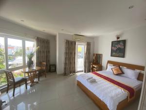 Postel nebo postele na pokoji v ubytování Đức Anh HoTel Vũng Tàu