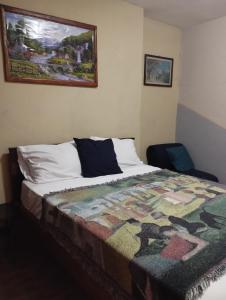 Rúm í herbergi á HOTEL EL ALMENDRO