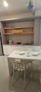 a kitchen with a table and a chair in it at Peace home09 in Cyberjaya