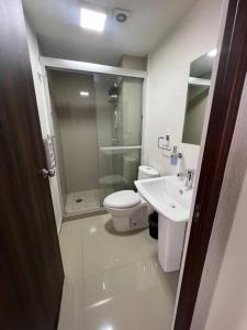 a bathroom with a shower and a toilet and a sink at Departamento en Coyoacan in Mexico City