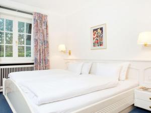 Ένα ή περισσότερα κρεβάτια σε δωμάτιο στο Enenhoog-Flugente