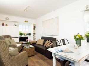 a living room with a couch and a table at Lukas-Hues in Kampen