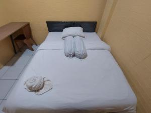 Postel nebo postele na pokoji v ubytování OYO 92891 Mahendra Homestay