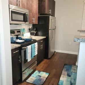 A kitchen or kitchenette at Stylish and Spacious, close to the Hospital.