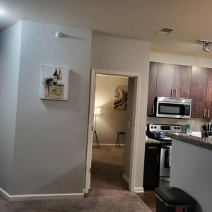 A kitchen or kitchenette at Stylish and Spacious, close to the Hospital.