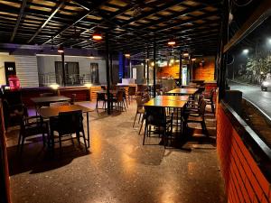 a dining room with tables and chairs in a restaurant at JW HERITAGE in Anjuna