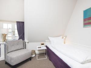 Llit o llits en una habitació de Hortensienhues-West