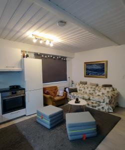 a living room with a couch and a table at Maggala apartments in Utsjoki