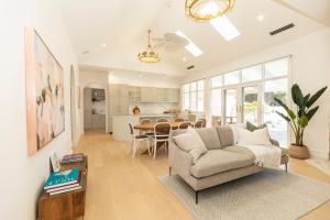 a living room with a couch and a table at White House Swan Hill in Swan Hill