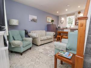 Χώρος καθιστικού στο Millgate Cottage