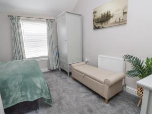 Ένα ή περισσότερα κρεβάτια σε δωμάτιο στο Millgate Cottage