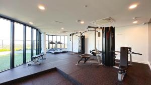 a gym with cardio equipment in a building at Panorama Apartment Walk to Box Hill Central by GoodLive in Box Hill