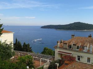 a view of the ocean from a building at Apartment Melita in Dubrovnik