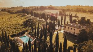 an aerial view of a house in a field of cypress trees at Agriturismo Terra Di Dio Toscanizzazione in Capannoli +65 photos