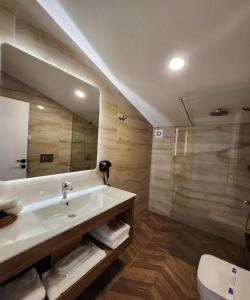 a bathroom with a tub and a toilet and a sink at Villa No 44 in Darıca