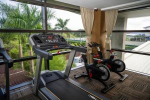 a gym with two exercise bikes in front of a window at The Bayleaf Cavite in General Trias