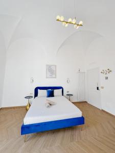 A bed or beds in a room at Alto Borgo Rooms