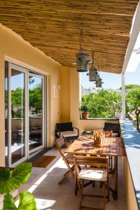 a dining room with a table and chairs on a patio at Zagara 139 in Ischia Town