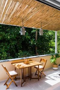 a wooden table and chairs on a patio at Zagara 139 in Ischia Town