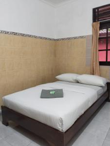 Postel nebo postele na pokoji v ubytování Hotel Lestari