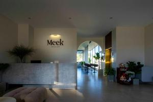 a lobby with a meet sign on the wall at Meek - Home and Coffee in Da Lat