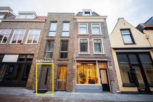a building with a entrance in front of it at Charming 60m2 One-Bedroom Apartment in Tiel