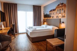 Rúm í herbergi á Hotel Am Sachsengang