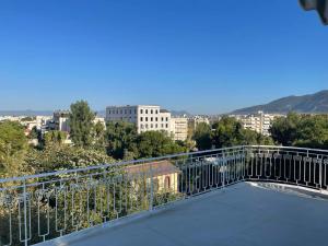 a balcony with a view of a city at ParkSide Loft in Kalamata