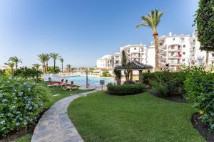 a resort yard with a swimming pool and buildings at 210 Mijas Sea View Bahia Playa in La Cala de Mijas