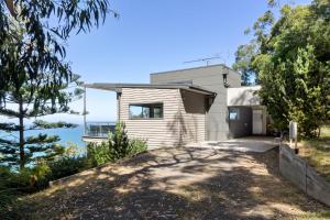 a house with a view of the ocean at Azure in Wye River