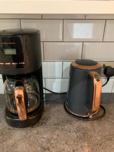 a coffee maker sitting on top of a counter at FBS Homestay in Norwood