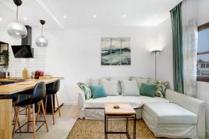 a living room with a couch and a table at El Drago in Costa Del Silencio