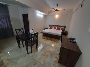 Oryx Home The Business Class Hotel客房内的一张或多张床位
