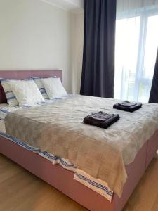 Кровать или кровати в номере Haki Apartment