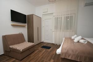Giường trong phòng chung tại P&P Apartmans Drapić