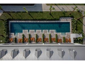 a rendering of a resort with chairs and a pool at Swandor Hotels & Resorts - Kemer in Kemer