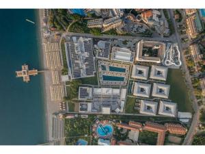 an overhead view of a city with buildings and water at Swandor Hotels & Resorts - Kemer in Kemer