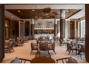 a restaurant with tables and chairs and a bar at Swandor Hotels & Resorts - Kemer in Kemer