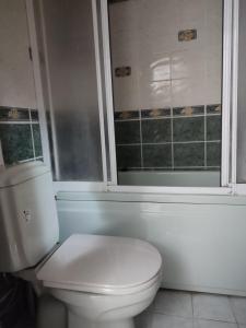 a bathroom with a white toilet and a window at Golden horn in Istanbul