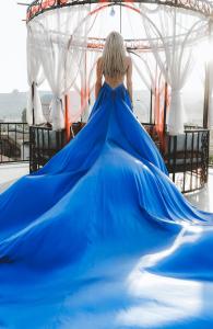 a woman in a blue dress riding a roller coaster at Cappadocia View Suit in Göreme