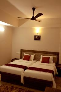 Oryx Home The Business Class Hotel客房内的一张或多张床位
