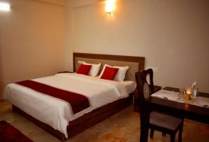 Oryx Home The Business Class Hotel客房内的一张或多张床位