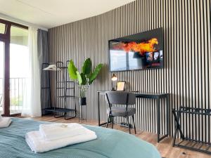 TV a/nebo společenská místnost v ubytování E&K living - SKY-TV - 23 OG - Stadtblick - Kongress