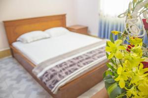 Postel nebo postele na pokoji v ubytování Khách sạn Ngân hàng - Bank Hotel