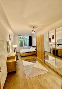 a living room with a bed and a window at Cosy flat nearTaksim/Nişantaşi in Istanbul